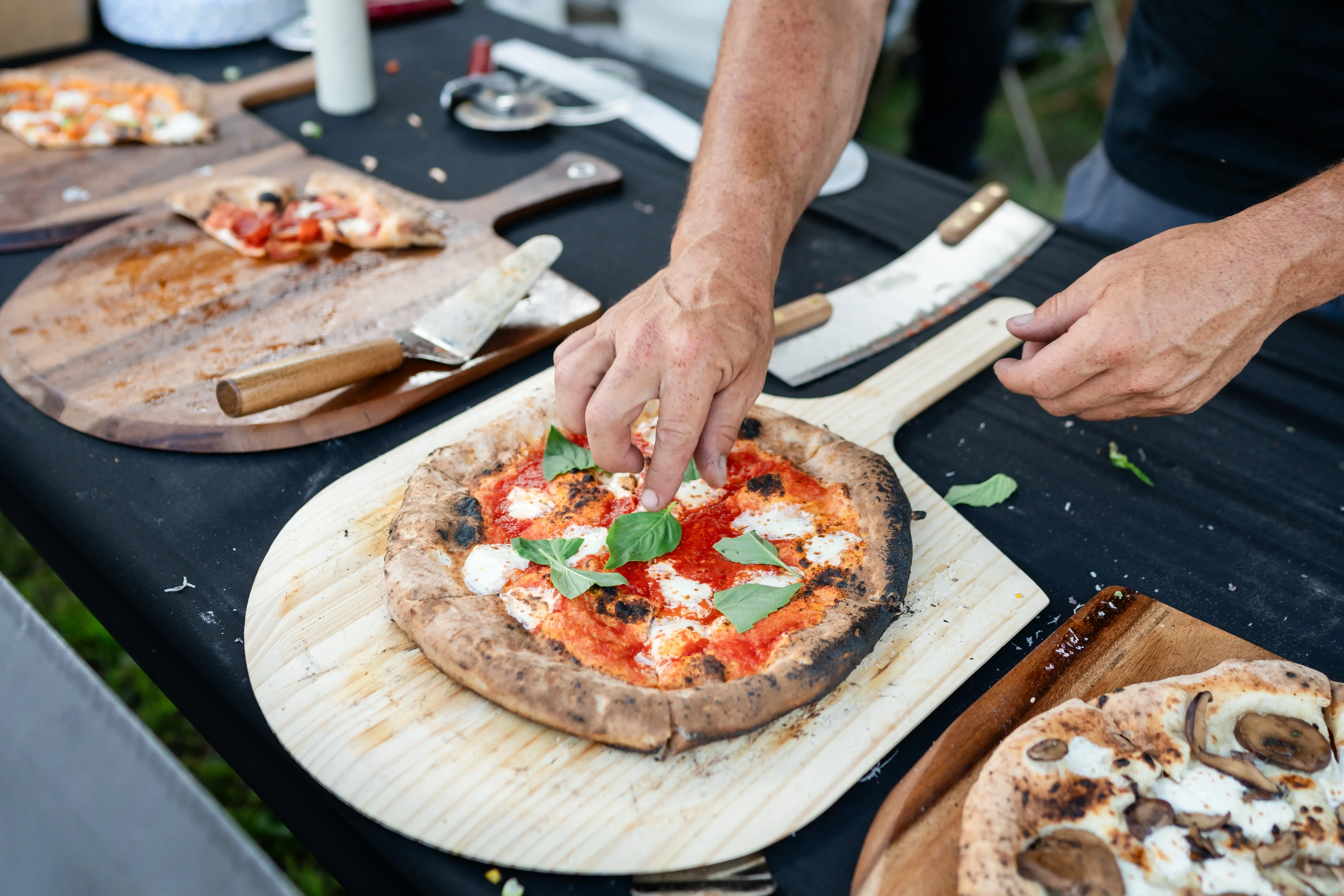 Preparing-Pizza-Toppings-Warriors-Pizza