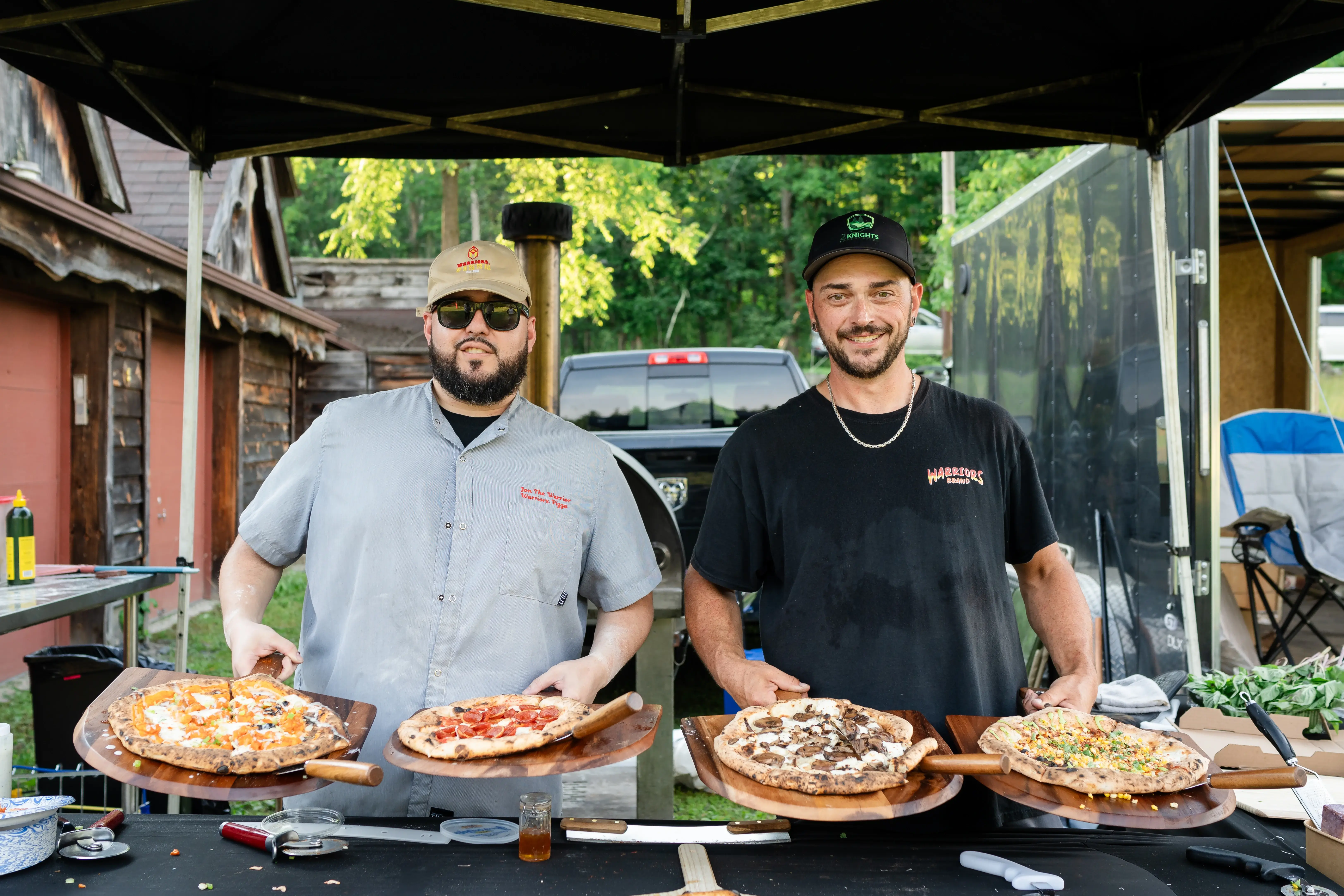 Warriors-Pizza-Team-Holding-Signature-Pizzas
